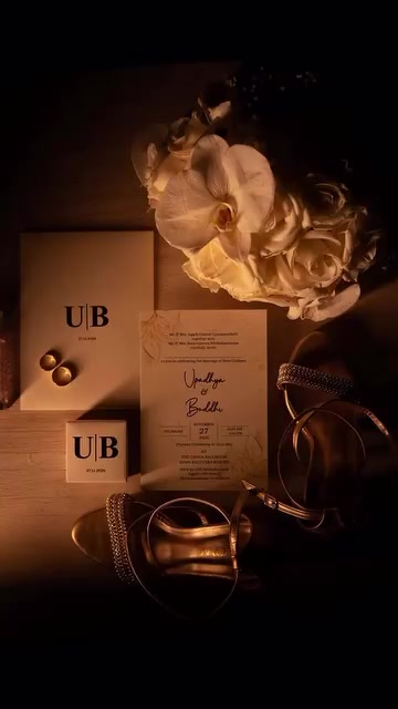 Wedding invitation, rings and flowers flat lay